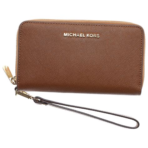 Hanging from a long strap that goes across your body, a crossbody bag allows for a hands-free experience. . Michael kors purse and wallet
